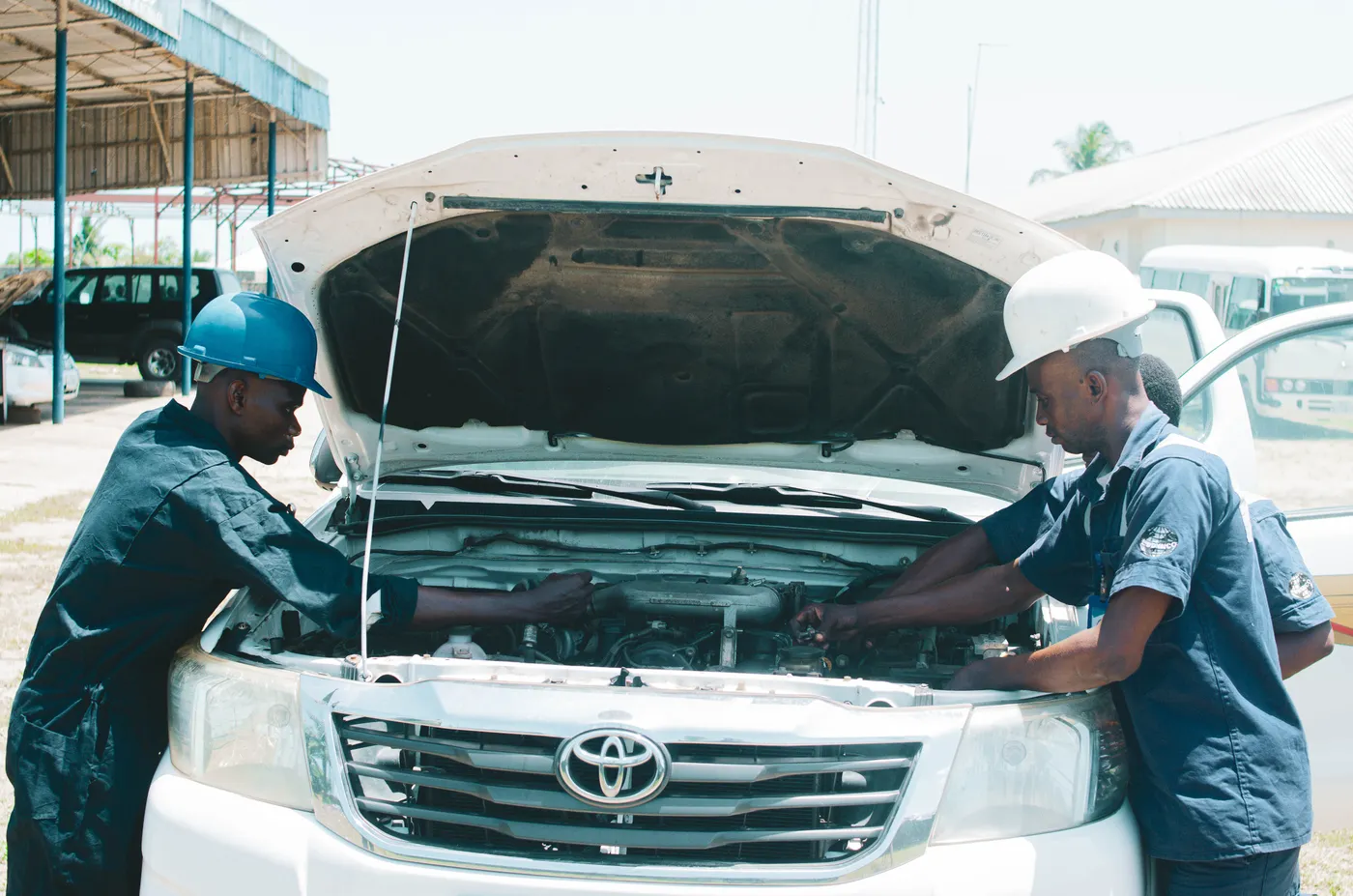 Mechanics checking a Toyota engine